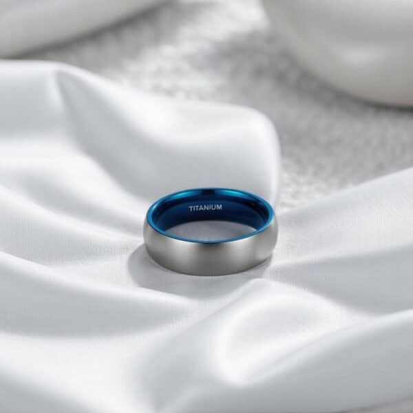 Mens brushed silver titanium ring with a brushed finish. Featuring a bold blue inside