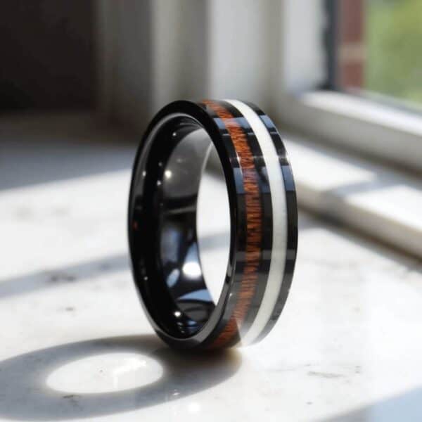 Mans fashion statement ring. A black tungsten band featuring wood and antler.