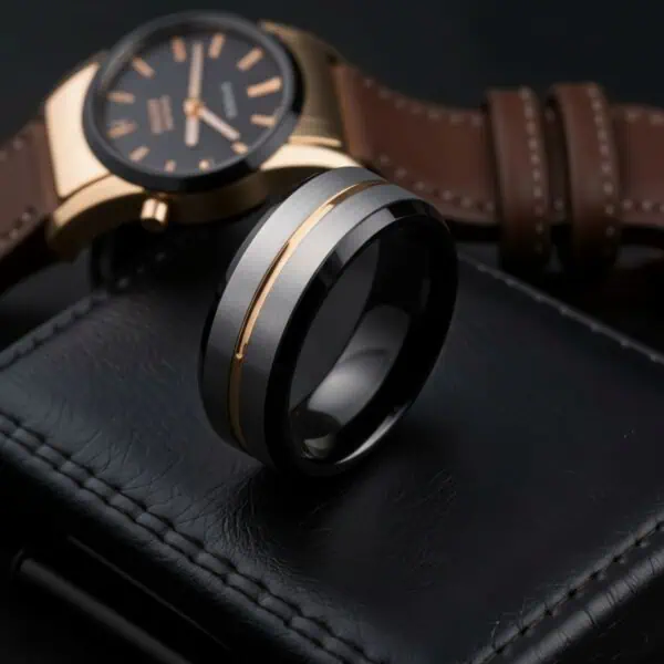 The Champion tungsten ring for men featuring a brushed silver centre with black edges and gold interior, bold mens wedding band with personalised ring engraving.