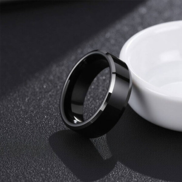 Eternity ring for men - a black tungsten band with bevelled edges that are polished silver