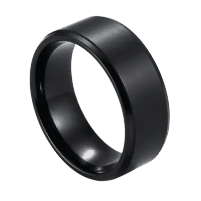 A zoomed in image showing a ring in close up detail. The ring is made with titanium and is all black. It has a slightly raised brushed centre and stepped polished edges.