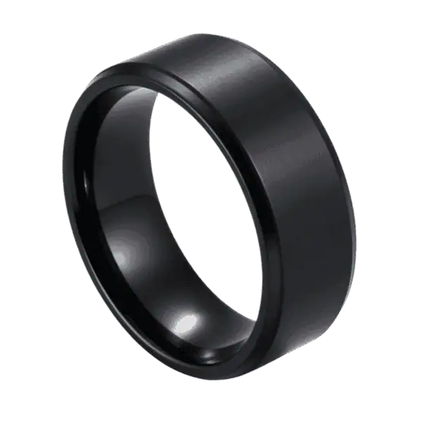 A zoomed in image showing a ring in close up detail. The ring is made with titanium and is all black. It has a slightly raised brushed centre and stepped polished edges.