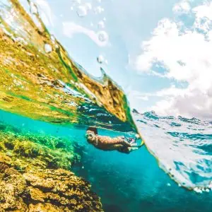 Man swims in the sea with his tungsten ring