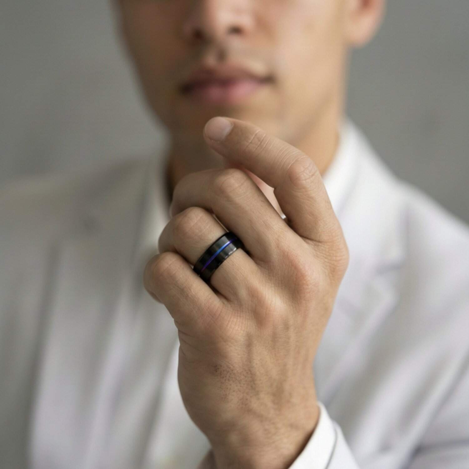 Black titanium ring for men with iridescent groove – mens wedding band with personalised custom engraving