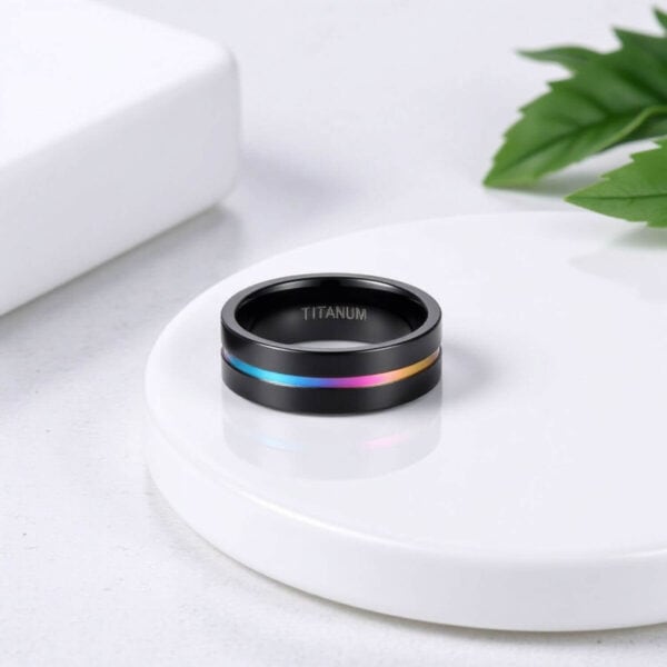 Mens black titanium ring with a groove of iridescent colour