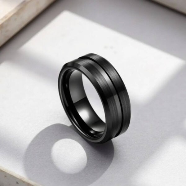 Mans black tungsten promise ring or eternity band. Featuring brushed centre sections, polished edges and a centre groove of smooth black