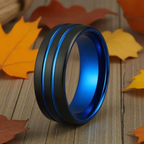 Innovative men's ring. A black band with blue grooves.