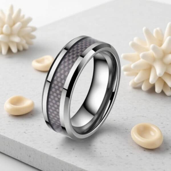 An elegant mans tungsten ring suited as a male statement ring or fashion accessory.