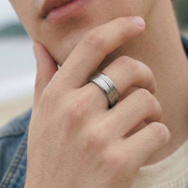 Silver tungsten wedding band with brushed and polished finish, engraved with a personalised groove design, perfect for men's wedding rings.