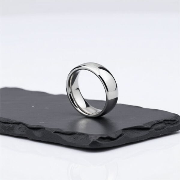 A traditional mans wedding ring made with titanium and finished in polished silver. Add a custom ring engraving for added personal touch.