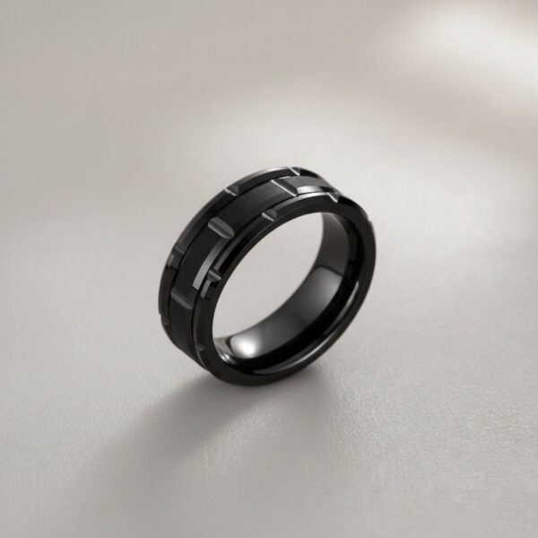 The Tyrone black tungsten mens engagement ring with brick tyre pattern, strong statement ring for guys with brushed detailing.