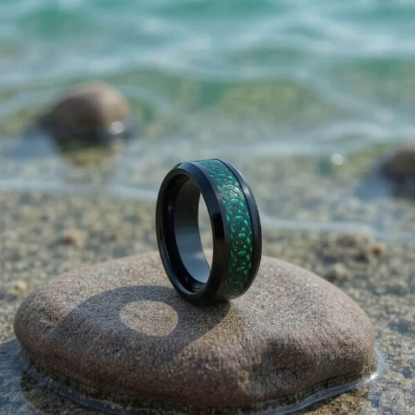 Mans black tungsten ring with dragon inspired carbon fibre inlay in green.