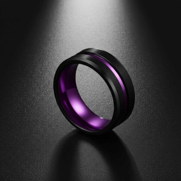 Men’s purple and black tungsten ring with polished purple detailing, finished with custom ring engraving.