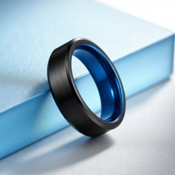 Blue men’s ring crafted from tungsten with a brushed black centre, worn as a promise or fashion ring.