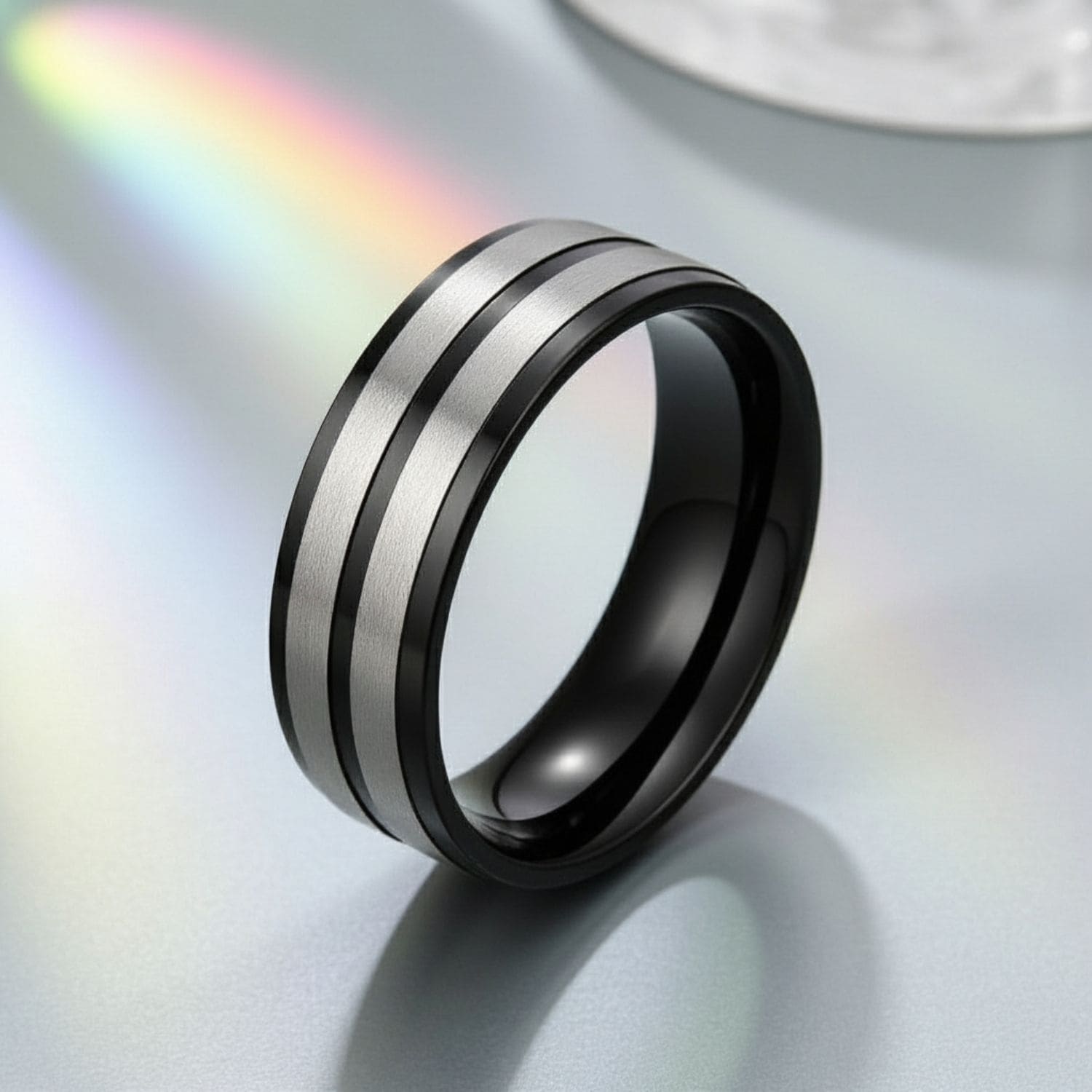 Men’s black and silver titanium fashion ring designed as a bold statement ring for him.