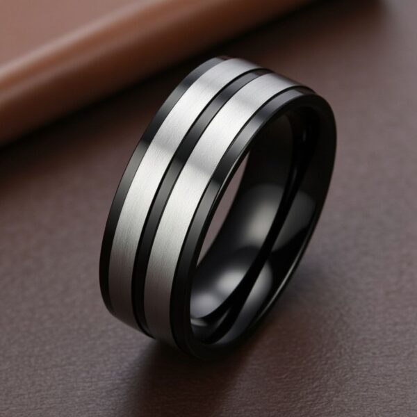 Silver and black ring for men crafted from titanium, worn as a promise ring or fashion ring.