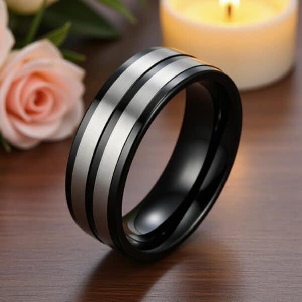 Titanium ring for men with polished black finish and brushed silver sections, shown with personalised engraving.