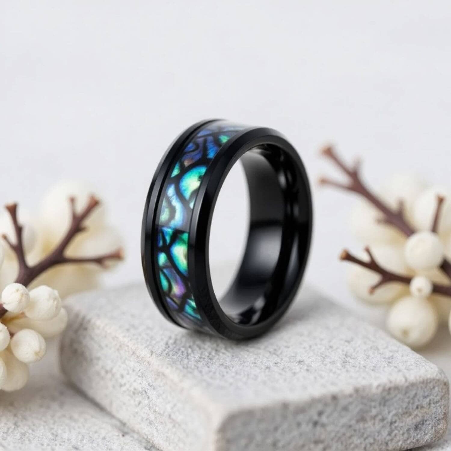 An engraved custom wedding band for Men with Abalone shell and interesting pattern - Black Titanium Mans Ring