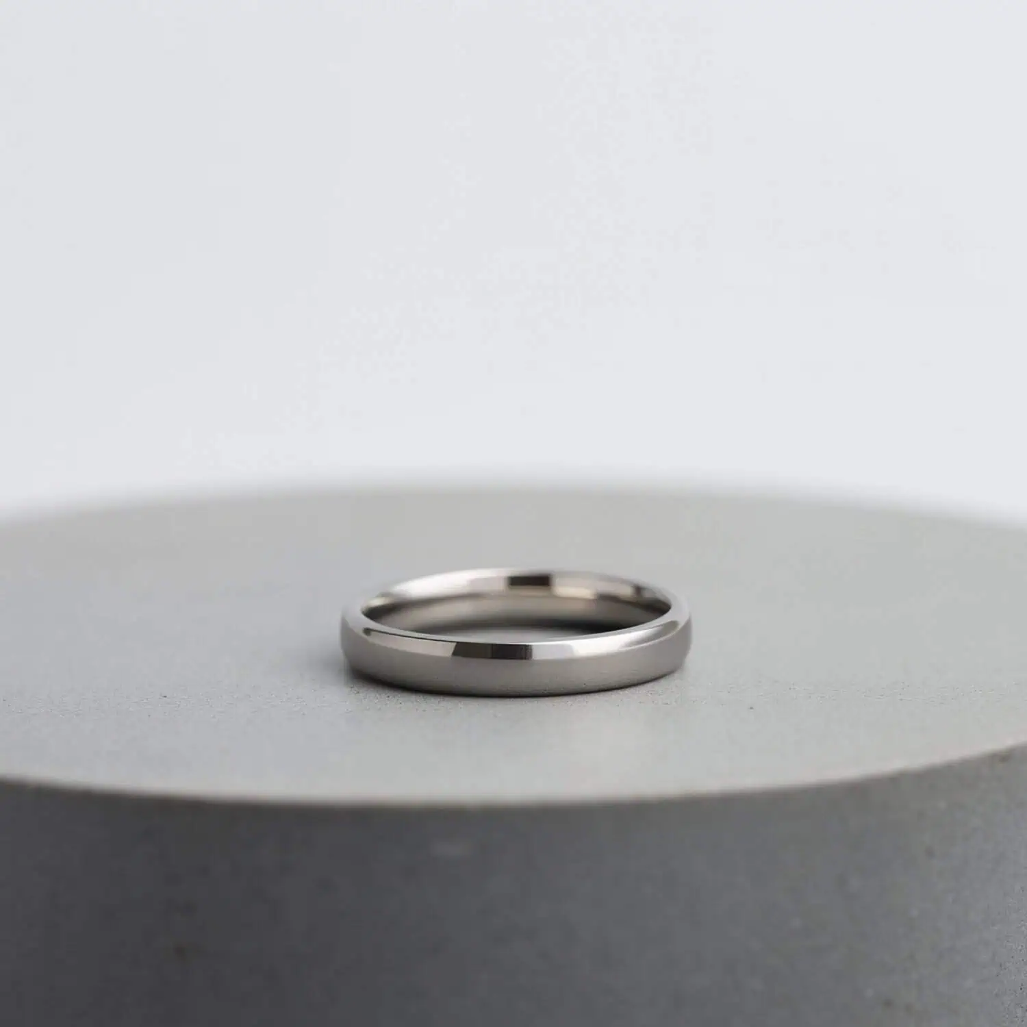 Polished silver titanium ring for men, slim 4mm gents wedding band or eternity ring with personalised engraving option.
