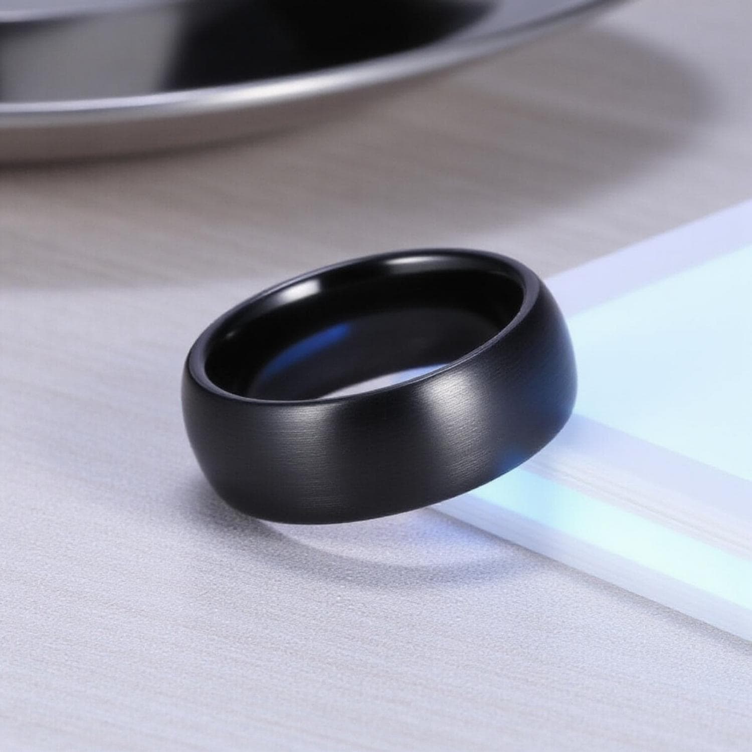 Menโs black ceramic ring โ The Panther stylish eternity band with custom ring engraving for him.