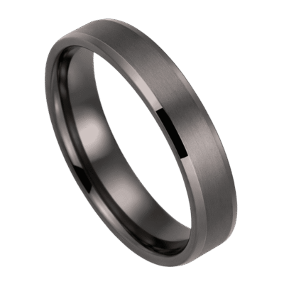 A zoomed in shot of a gunmetal grey tungsten ring. It has a brushed finish and bevelled edges.