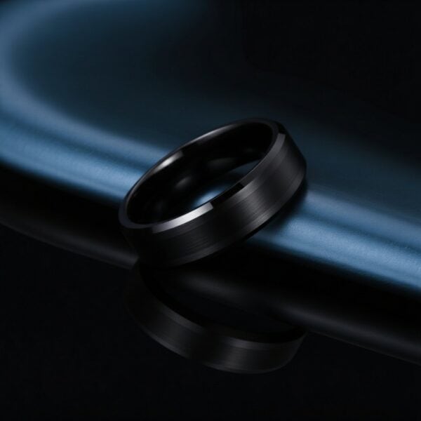 Brushed and polished black tungsten ring for men, elegant wedding or engagement band with engraving.