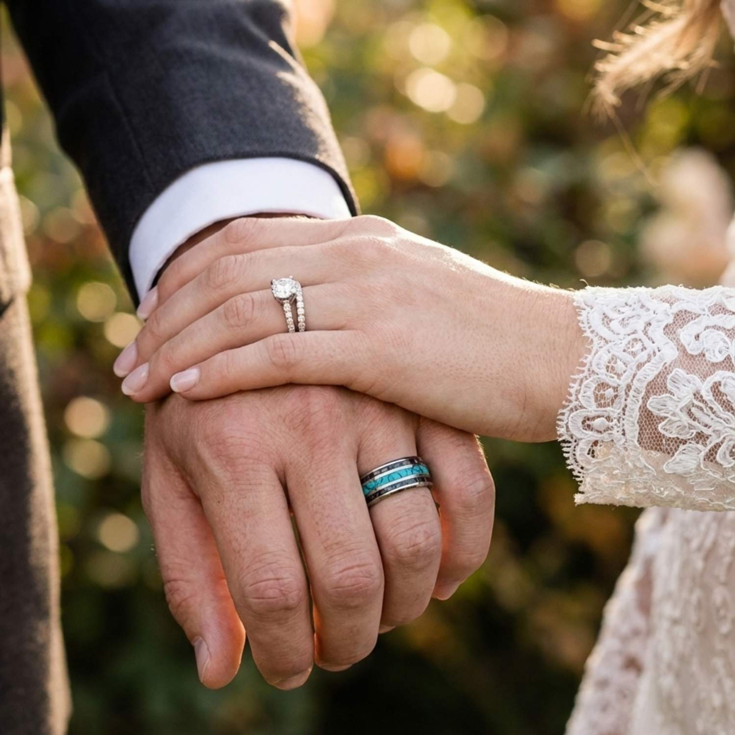 Close-up of newlyweds holding hands with the groom wearing the Rio tungsten wedding ring featuring turquoise and natural abalone shell inlays.