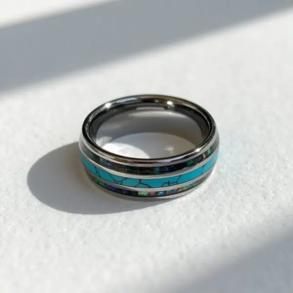 Men’s turquoise tungsten ring with abalone shell inlay and engraving, perfect as an eternity or fashion ring.
