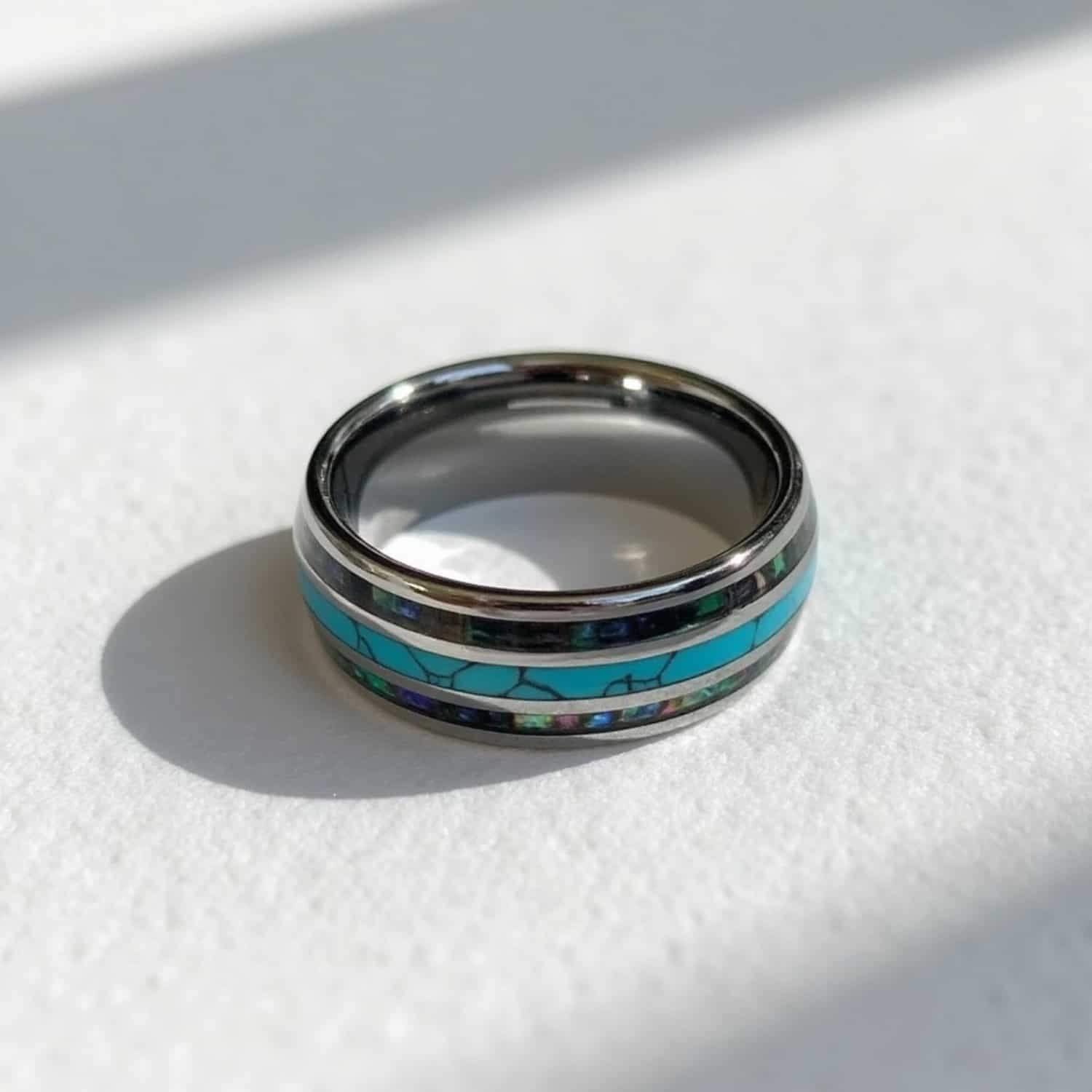Men’s turquoise tungsten ring with abalone shell inlay and engraving, perfect as an eternity or fashion ring.