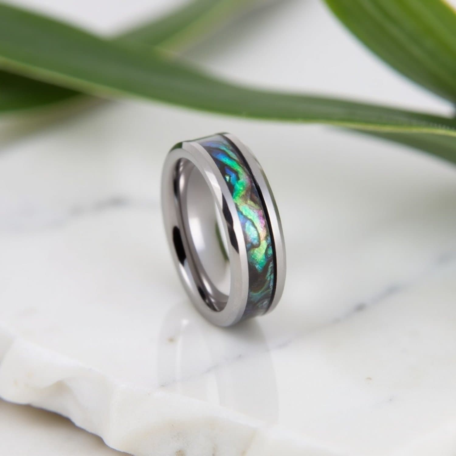 Menโs tungsten promise ring featuring abalone shell inlay and polished bevelled edges.