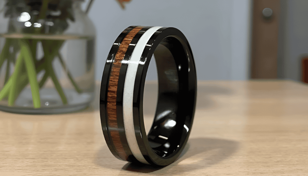 Buck men’s black tungsten promise ring with antler and koa wood inlay — a bold and rustic wedding or eternity band, customisable with engraving for a personalised touch.