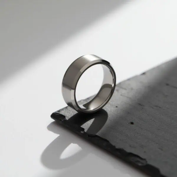 White gold tungsten ring for him with polished bevelled edges and brushed centre. Perfectly suited as a mens wedding band or engagement ring