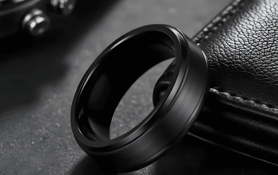 Bold black ring featuring a sleek matte finish, perfect for men's fashion accessories or wedding bands. High-quality craftsmanship with a modern design, suitable for stylish occasions.