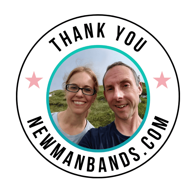 Photo of happy couple outdoors, thanking fans with a branded Newman Bands badge for personal gratitude and connection.