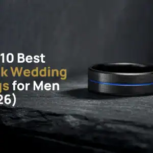 The Visionary brushed black tungsten ring with a blue groove on dark slate, beside the title The 10 Best Black Wedding Rings for Men (2026)