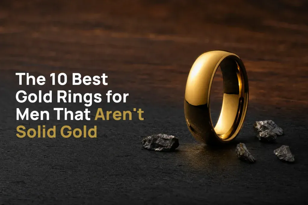 The King polished gold-coloured tungsten ring standing on dark slate beside flecks of raw tungsten, with the title The 10 Best Gold Rings for Men That Aren't Solid Gold