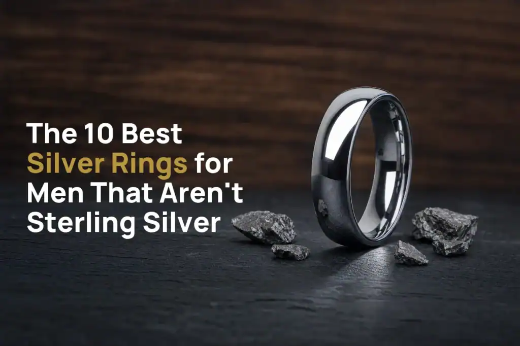 The Elie polished silver-coloured tungsten ring standing on dark slate beside flecks of raw tungsten, with the title The 10 Best Silver Rings for Men That Aren't Sterling Silver