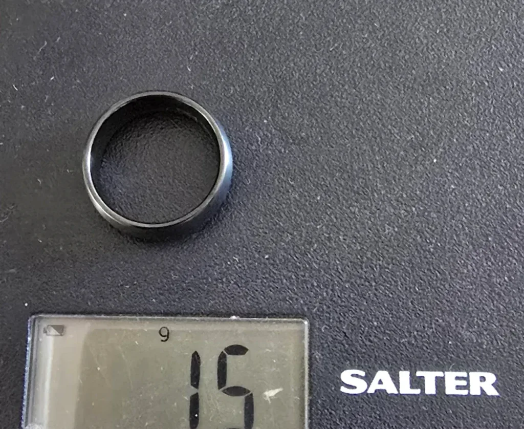 The Jet brushed black tungsten ring on a Salter scale reading 15 g