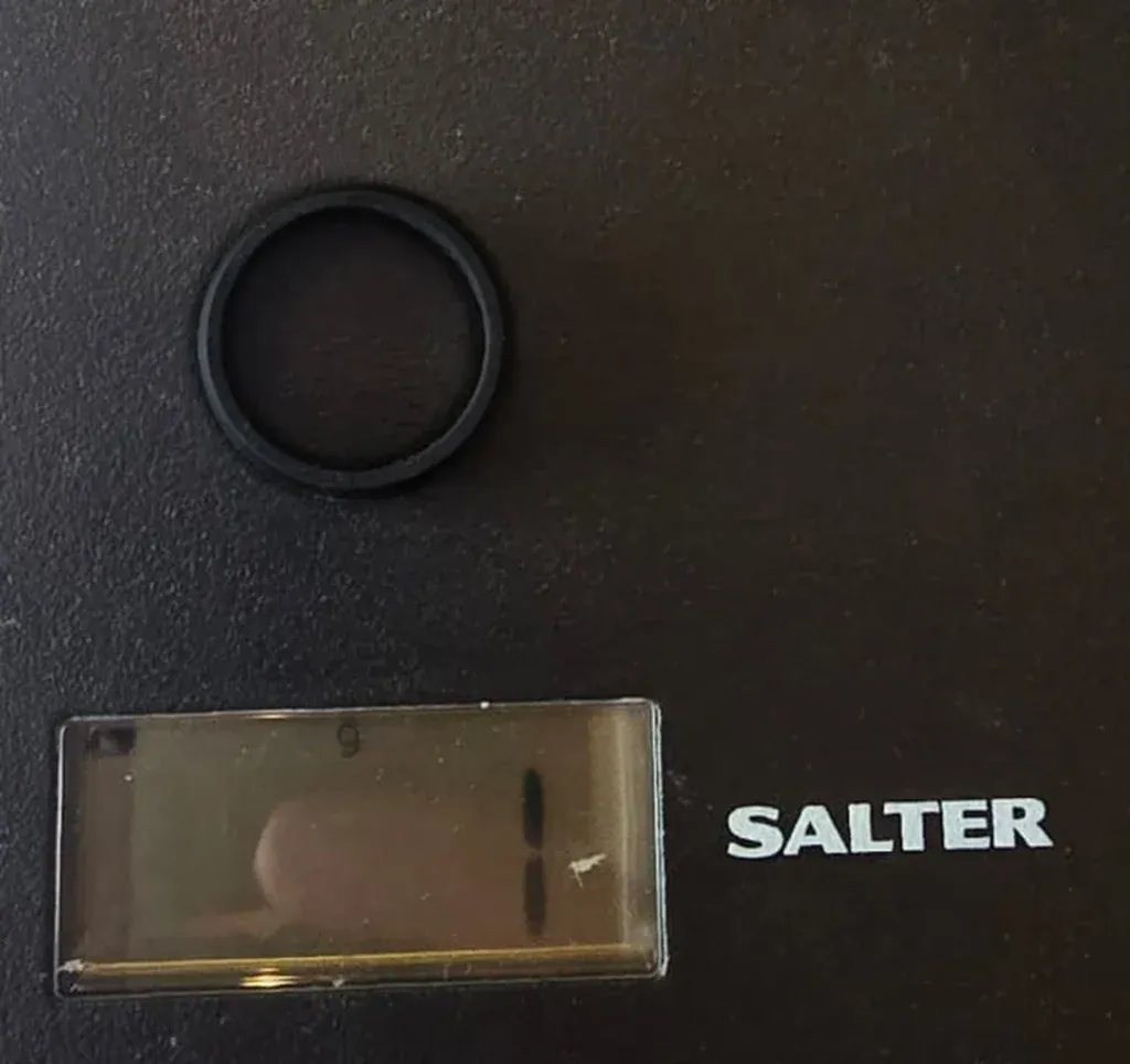 The Kepler black silicone ring on a Salter kitchen scale reading 1 g