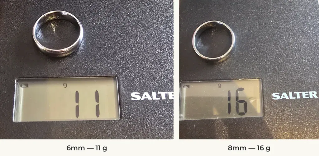 The Elie 6mm and 8mm silver-coloured tungsten rings on a Salter scale reading 11 g and 16 g