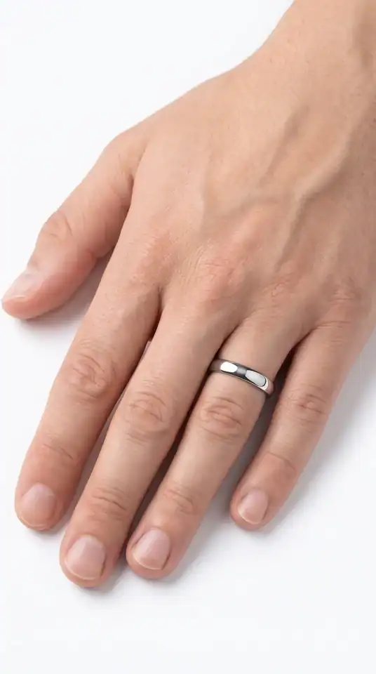 Elie Thin Style 4mm silver tungsten ring from Newman Bands worn on a man's ring finger
