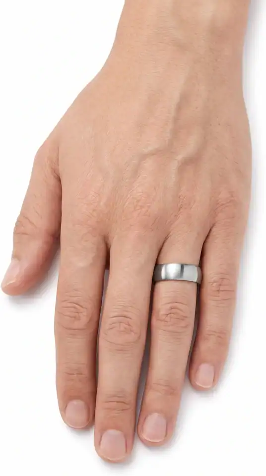 Tranquil silver titanium ring from Newman Bands worn on a man's ring finger