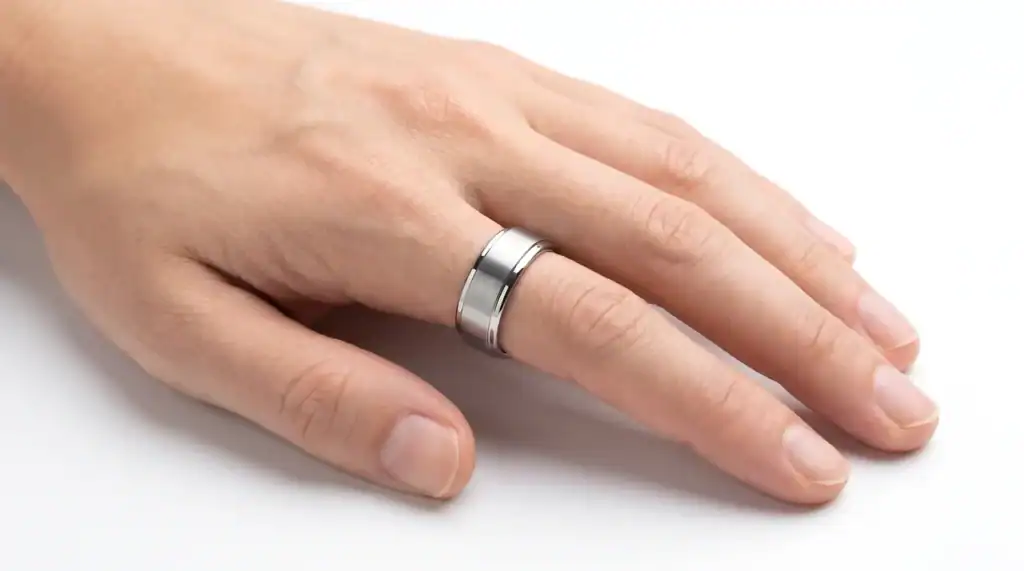 Zen silver tungsten ring from Newman Bands worn on a man's ring finger