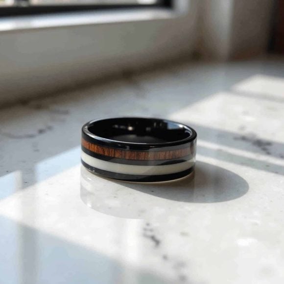 A magnificent mens tungsten ring - a black band with wood and antler inlays